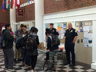 Bedford Police Chief Robert Bongiorno, an MCC alum, joined Officer Craig Naylor for the college’s first Coffee with a Cop on Main Street in Bedford